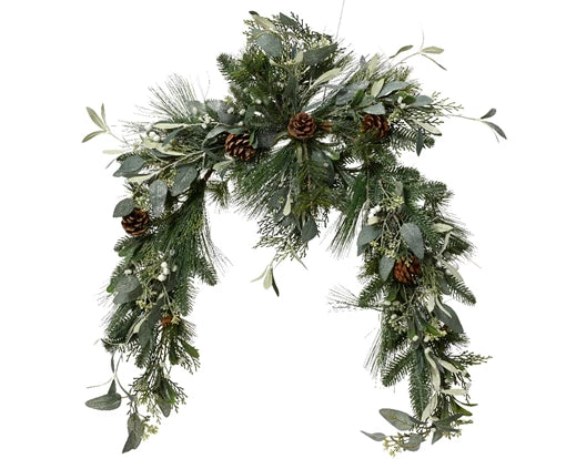 A wreath of green eucalyptus leaves and pinecones with glitter on the pinecones.