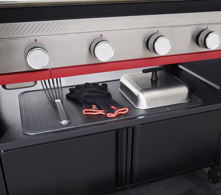 Weber SLATE storage area with a spatula gloves and cloche