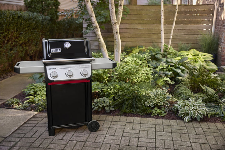 Weber Spirit E-310 Gas BBQ in a garden