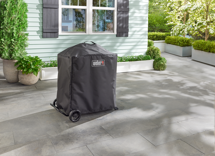 Weber Traveler Compact Cover in a garden in Ireland