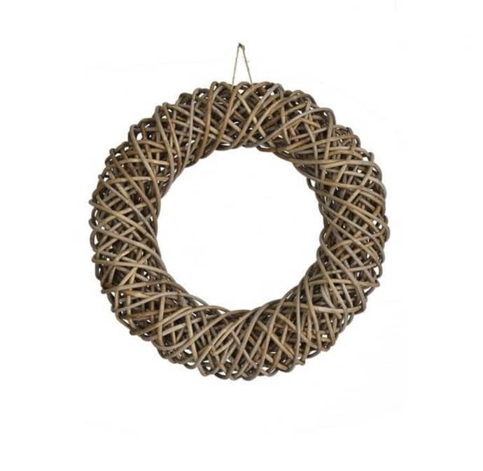 A round wreath made of interwoven brown branches, designed for hanging.