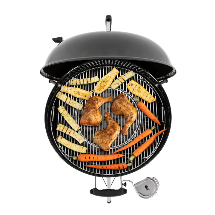 food sitting on grill grates on a Weber Master-Touch E-5750 barbecue