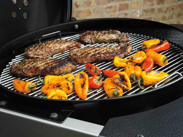 food cooking on a Weber Performer Barbecue grill grate