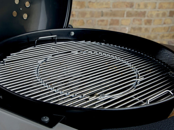 Stainless steel grill grates inside a Weber Performer Barbecue