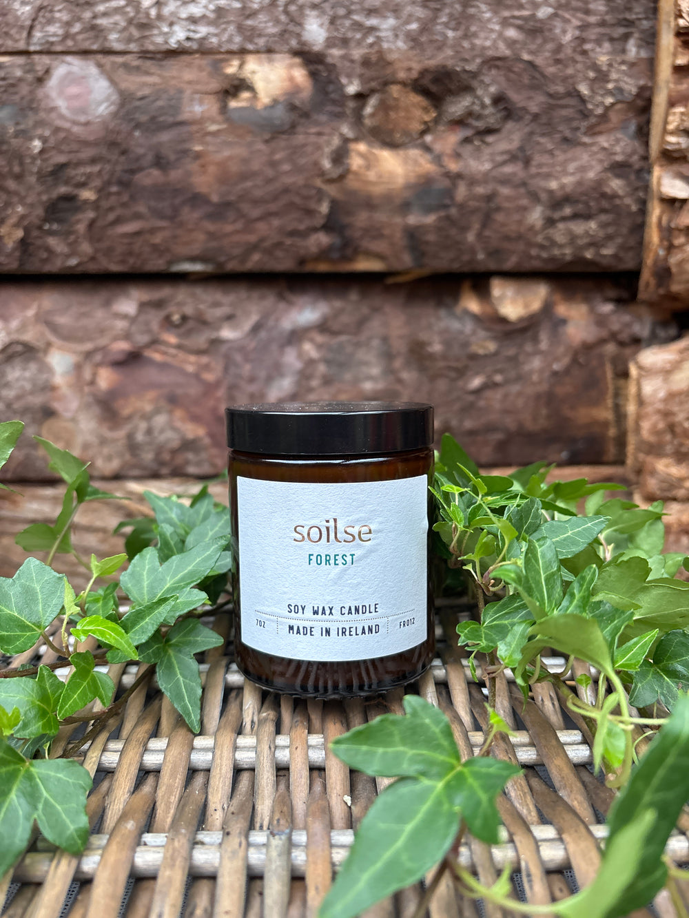 Soilse Forest Apothecary Amber Jar Candle with bluebell, balsam, and pine scent notes