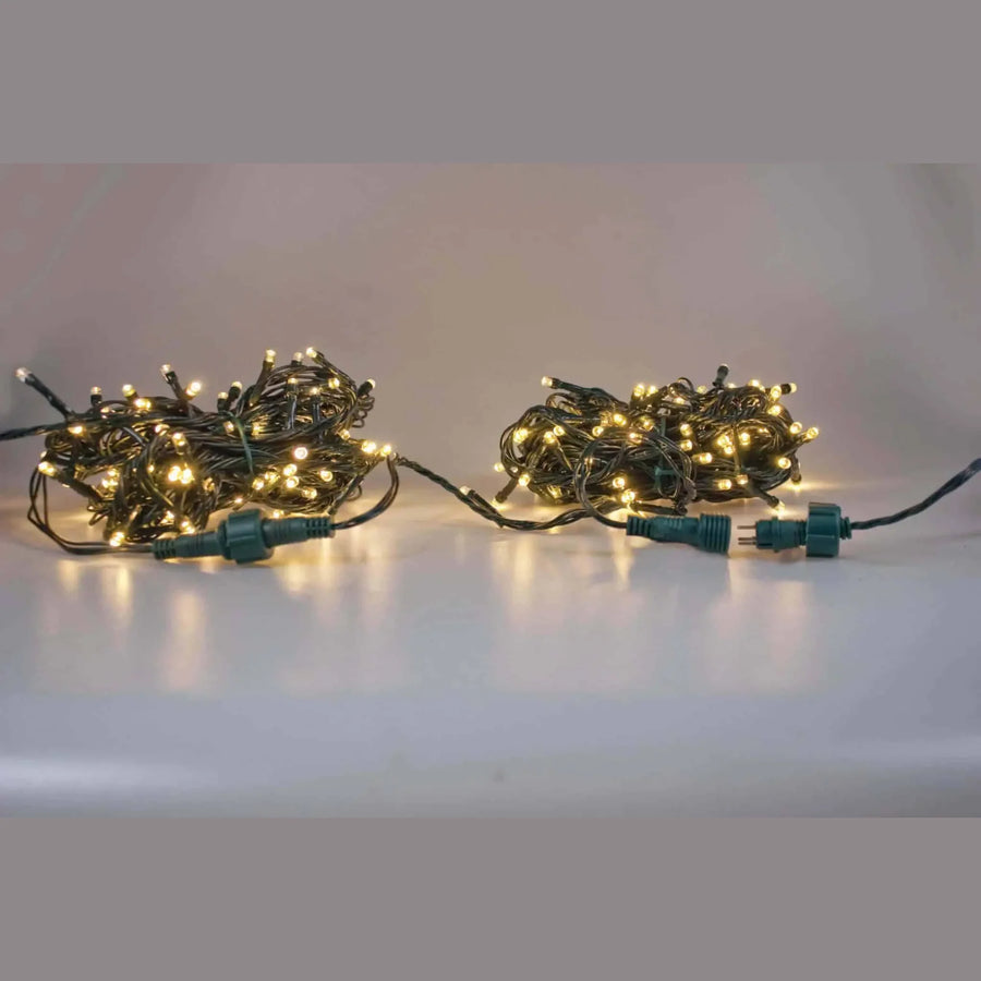 Warm white 100 LED extension set for Christmas lights on green cable