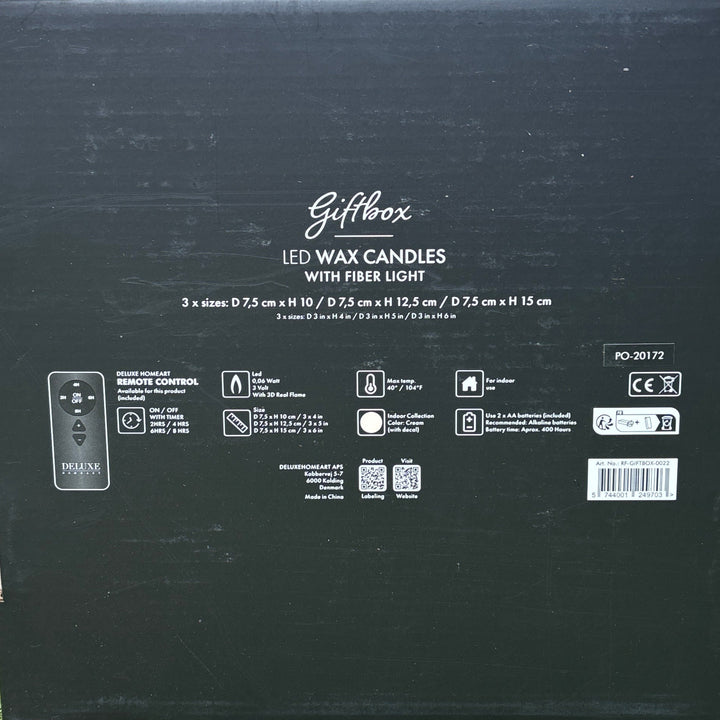 Black box with text on a woven surface and green grass background