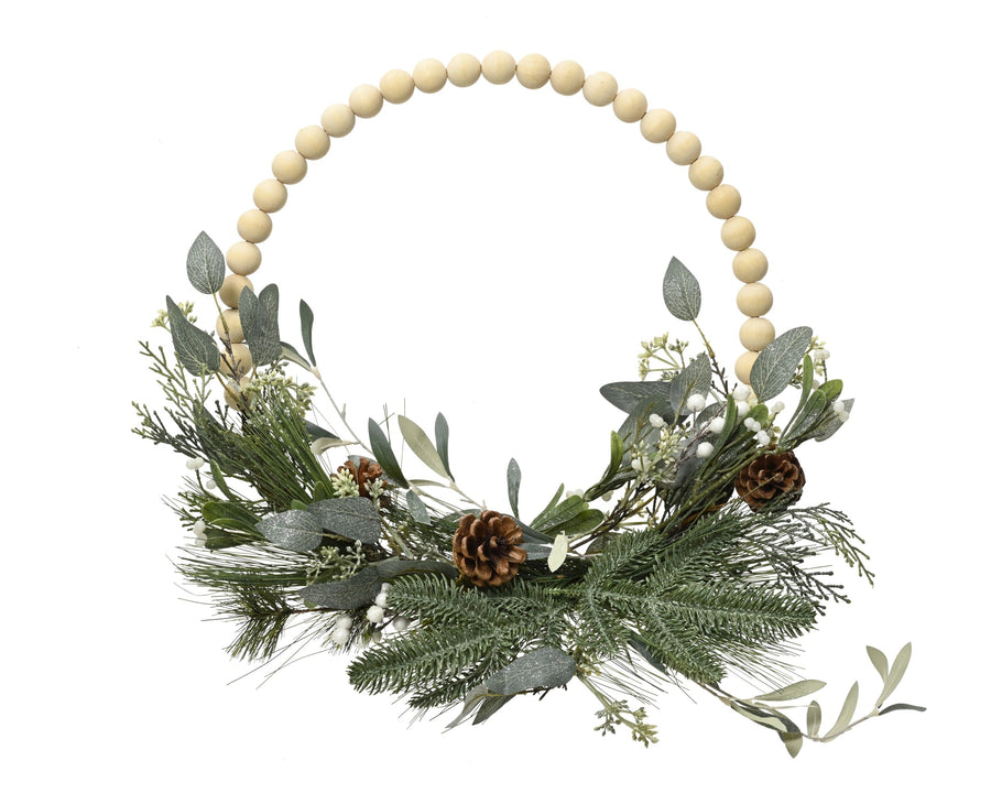 Modern green Christmas wreath with glitter wooden balls, pinecones and eucalyptus
