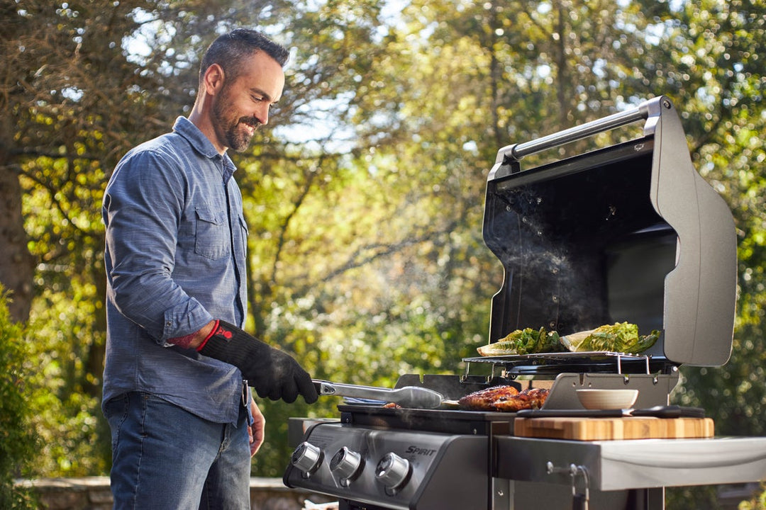 Man cooking on a Weber Gas BBQ in Ireland