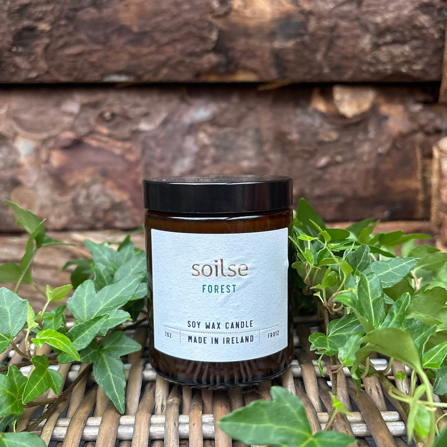 Soilse Forest Apothecary Amber Jar Candle with bluebell, balsam, and pine scent notes