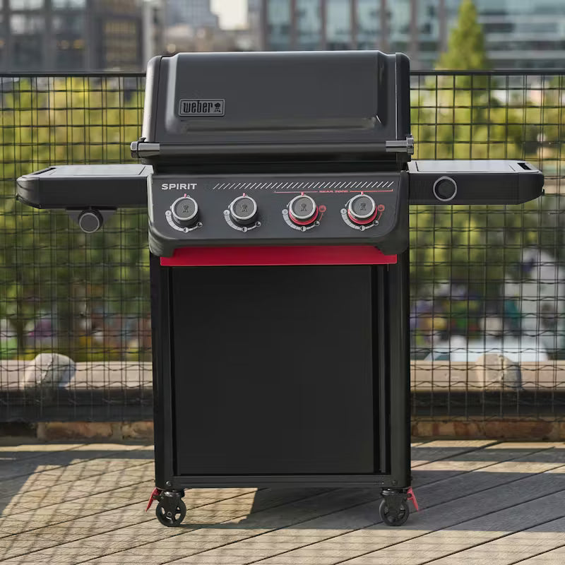 Spirit Stealth Weber grill on a wooden deck with a cityscape background