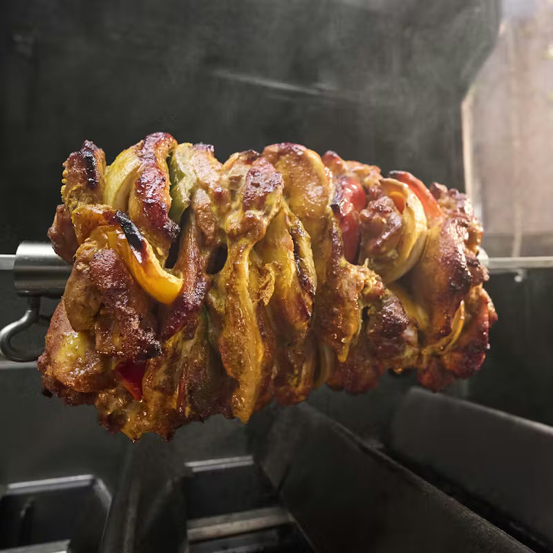 Food cooking on a Weber Spirit Rotisserie