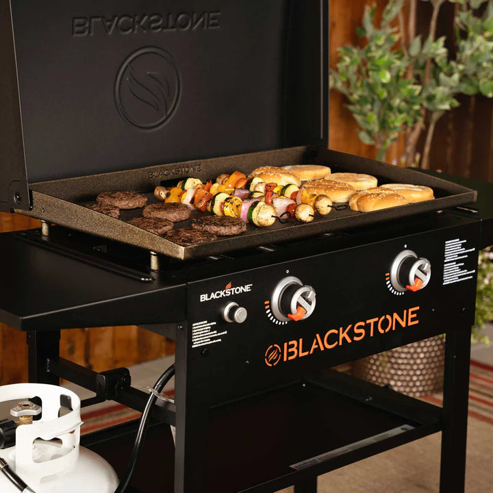 Blackstone28 Griddle grill with food being cooked outdoors