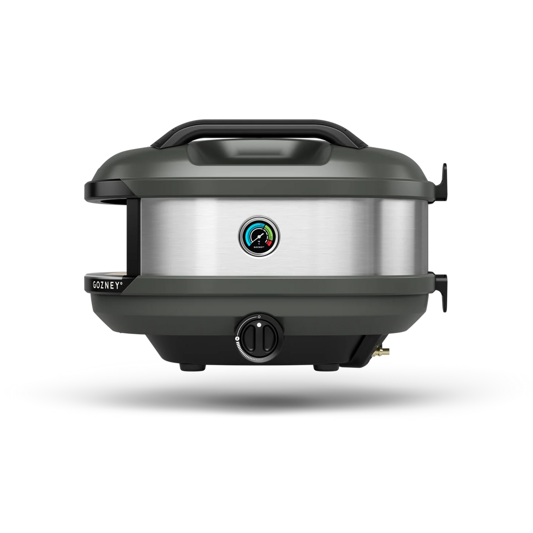 A GOZNEY electric grill in dark gray and brushed stainless steel, shown from a front three-quarter angle on a white background with a soft shadow.