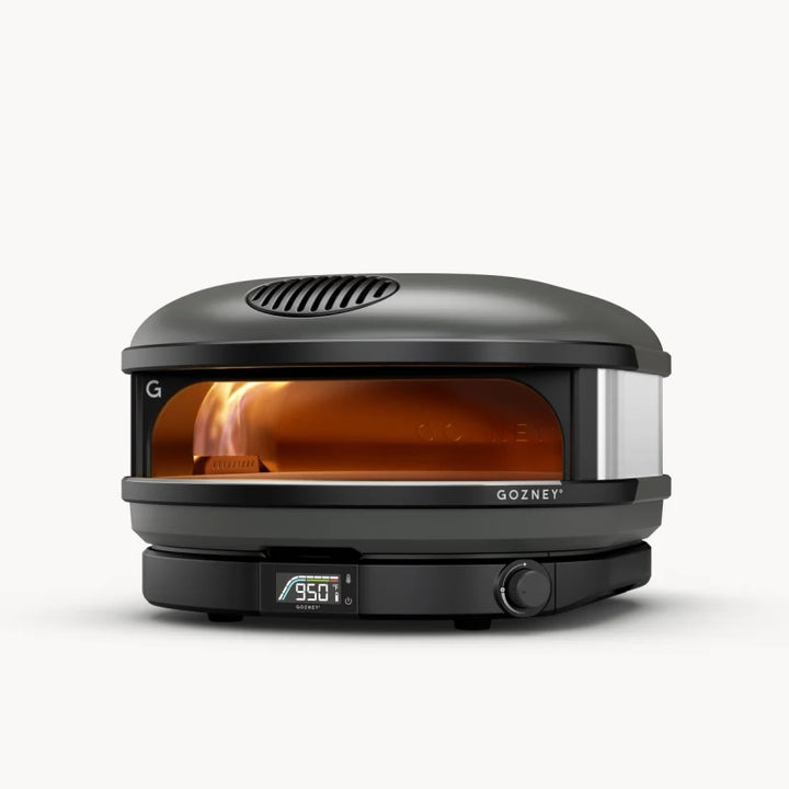 Black Gozney pizza oven with glass door on a white background