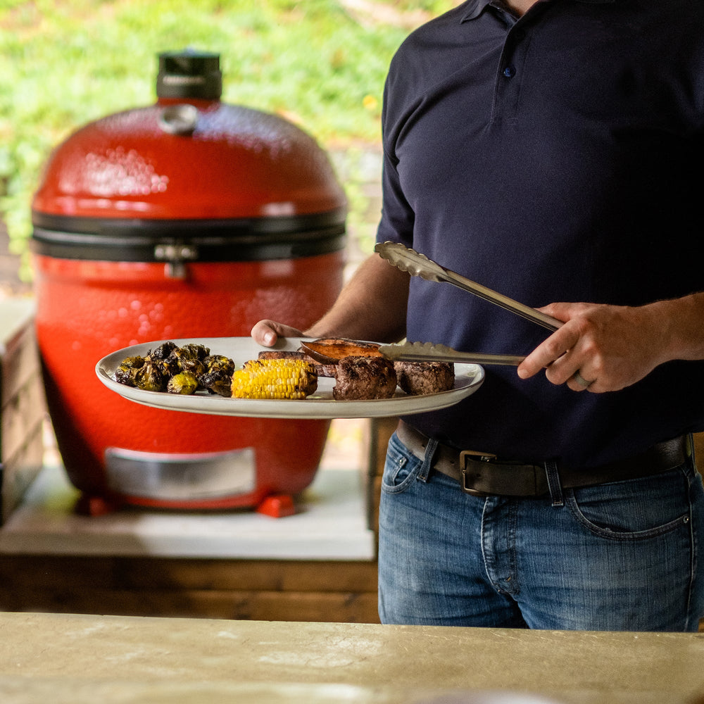 Kamado Joe Big Joe III Standalone kamado grill in an outdoor lifestyle setting