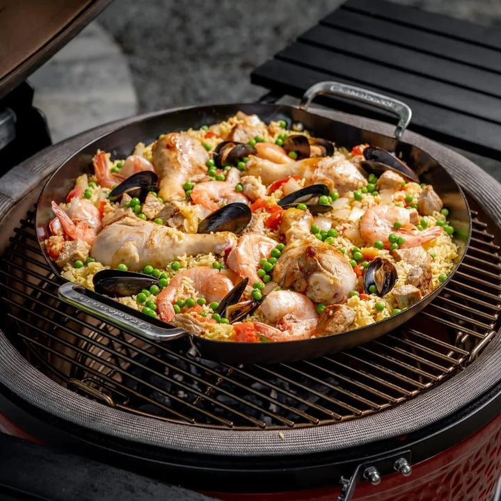 Kamado Joe Paella Pan sitting on grill grates