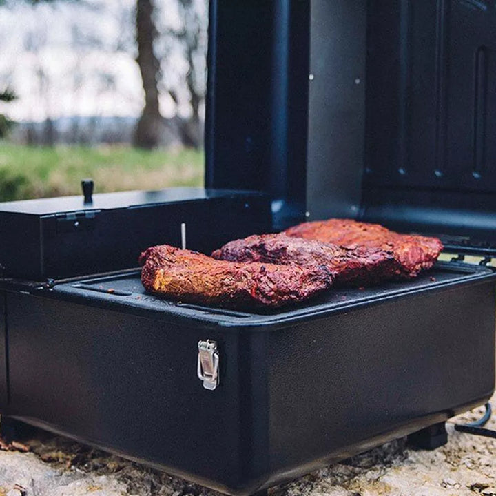 Cooking on Traeger Ranger with a forest background