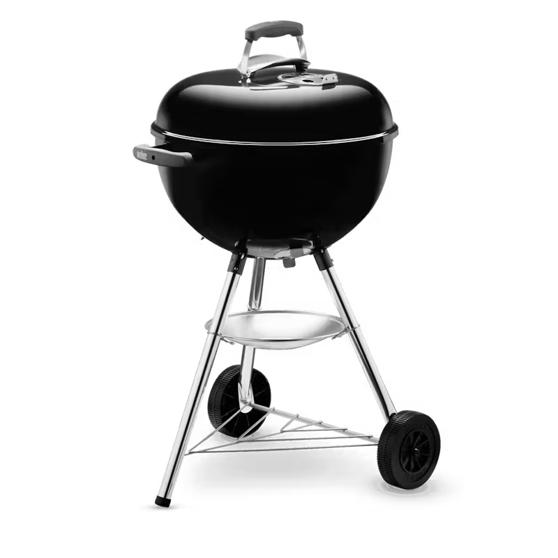Black Weber kettle grill on wheels with a transparent background