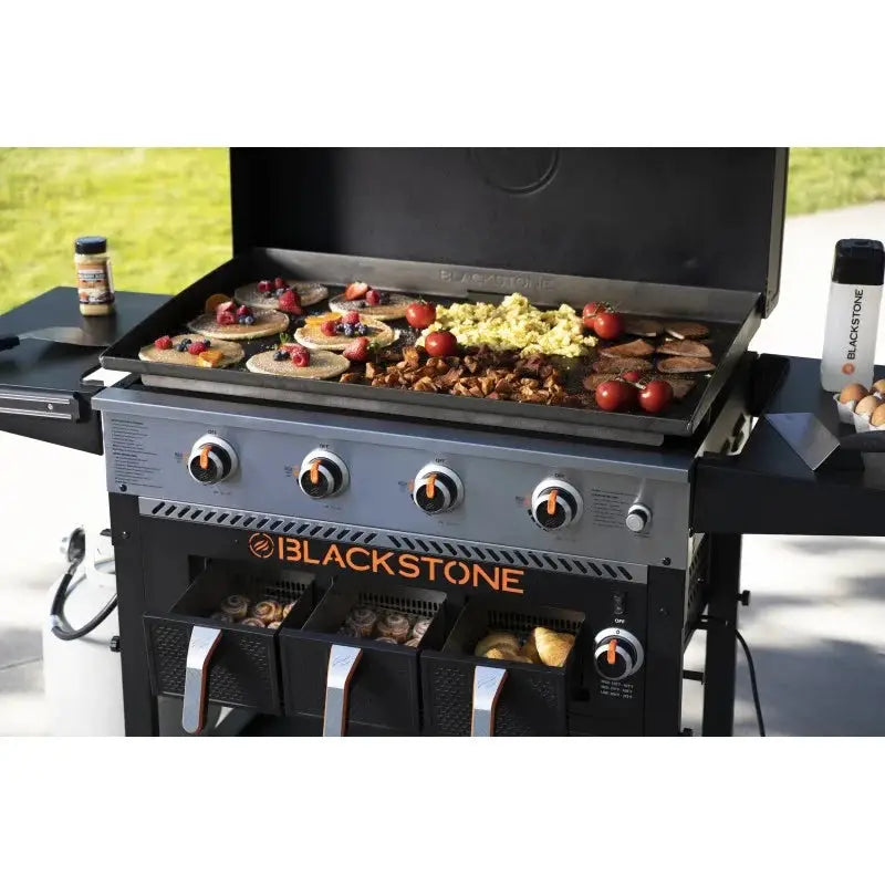 Blackstone grill with food on a patio