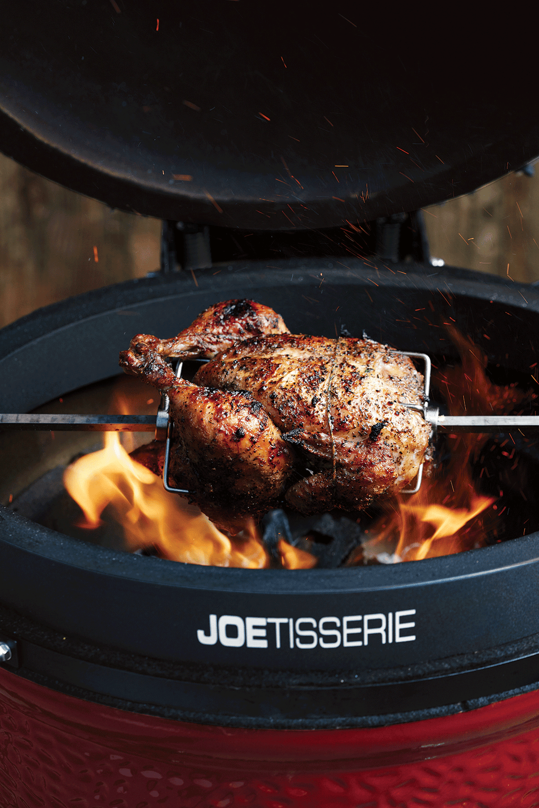 Chicken cooking on the Kamado Joe Joetisserie charcoal rotisserie