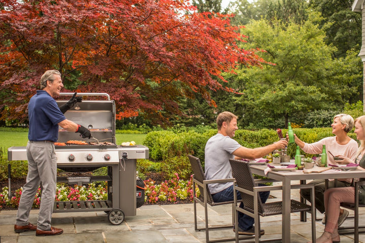 Weber Griddle on a Genesis E410 BBQ in a garden