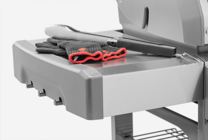 Tongs on a Weber Genesis II E310 Gas Grill