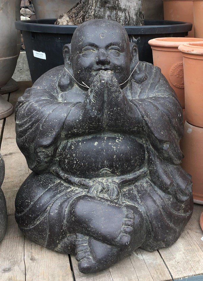 Sitting monk, laughing